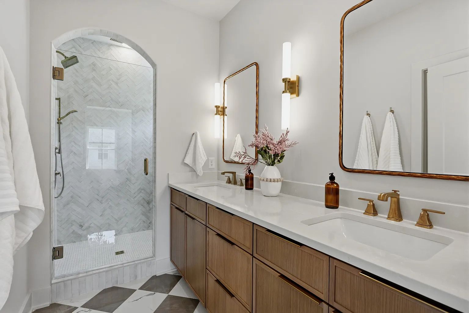 Primary bathroom with freestanding tub and brass fixtures
